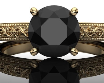 May include: A gold engagement ring with a black diamond set in a vintage-inspired filigree band.