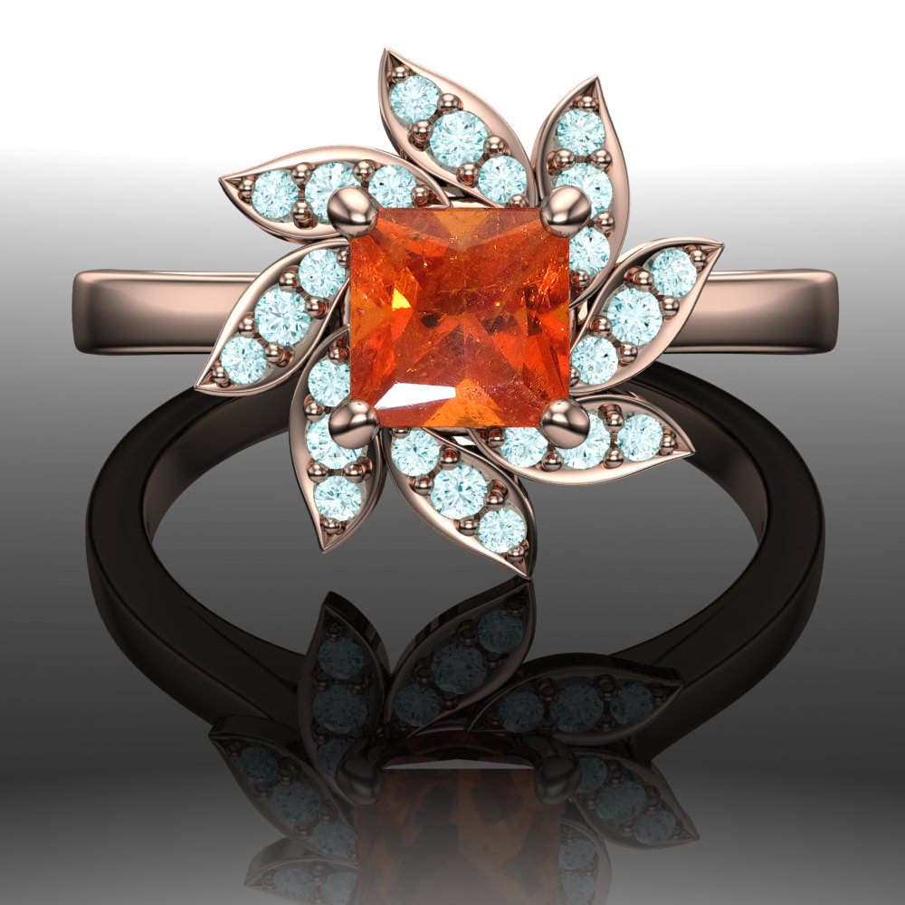 Floral Cluster Ring with Orange Spessartite Garnet and Blue Diamonds Floral Cluster Ring with Orange Spessartite Garnet and Blue Diamonds