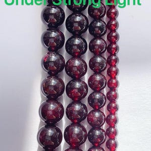 Pulsera elástica de cuentas redondas lisas de granate rojo natural AAA, piedra preciosa, piedra natal de enero imagen 8