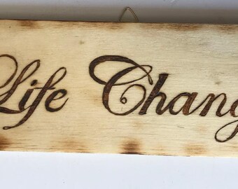 Wood burned sign "Life Changes"