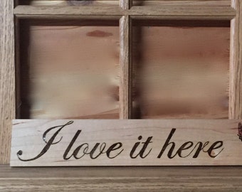 I love it here - Wood burned sign