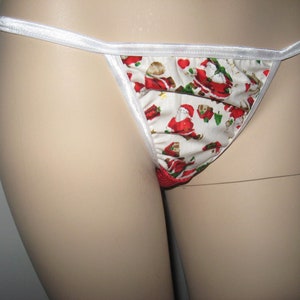 May include: White and red Christmas themed underwear with a white satin trim.