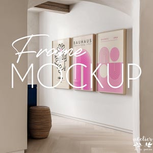 May include: Three framed art prints with beige mats and light wood frames hang on a white wall. The prints feature abstract designs in pink, black, and beige. The text "Frame MOCKUP" is overlaid on the image.