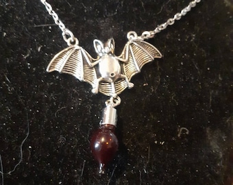 macabre gothic vampire bat and vial of blood pendant. Also available with empty vial to fill yourself