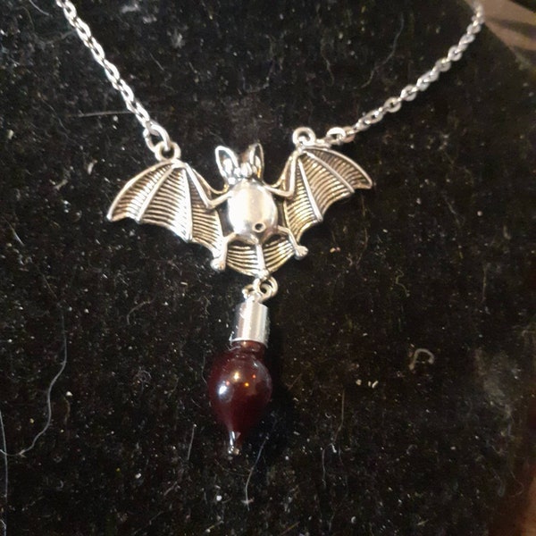 macabre gothic vampire bat and vial of blood pendant. Also available with empty vial to fill yourself