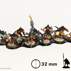 May include: A set of ten 32 mm round bases for miniature figures. The bases are black with a textured surface and are arranged in a row. The bases are designed to hold miniature figures, such as those used in tabletop wargames.  Models not included.