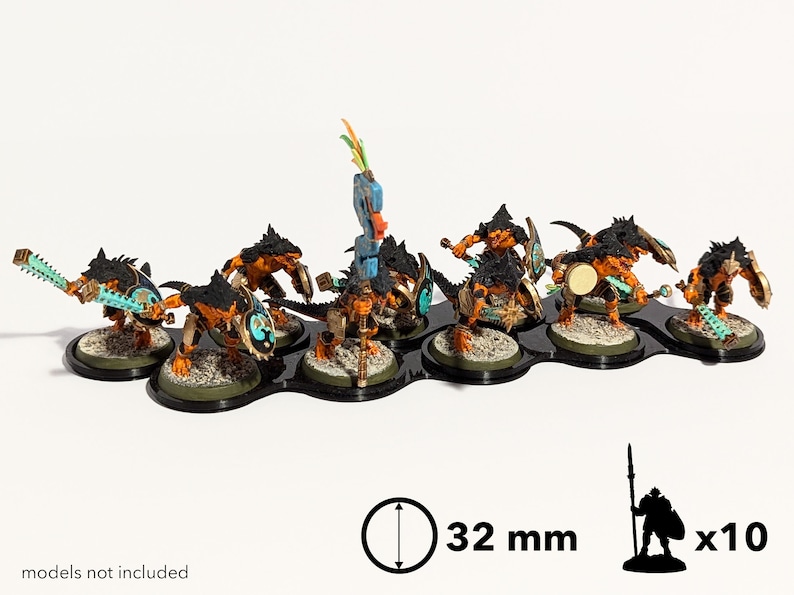 May include: A set of ten 32 mm round bases for miniature figures. The bases are black with a textured surface and are arranged in a row. The bases are designed to hold miniature figures, such as those used in tabletop wargames.  Models not included.