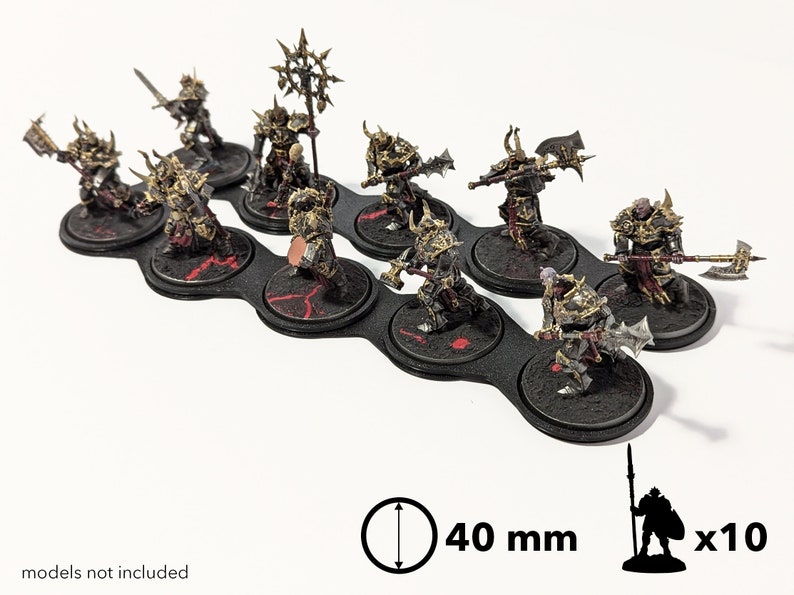 May include: Ten 40 mm round black plastic bases with red accents, designed to hold miniature figures. The bases are arranged in a row and feature a textured surface.  Models not included.