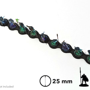 May include: A black plastic base with ten 25 mm round slots for miniature figures. The slots are filled with painted miniature figures with blue, green, and purple paint. The text "x10" is visible in the image.