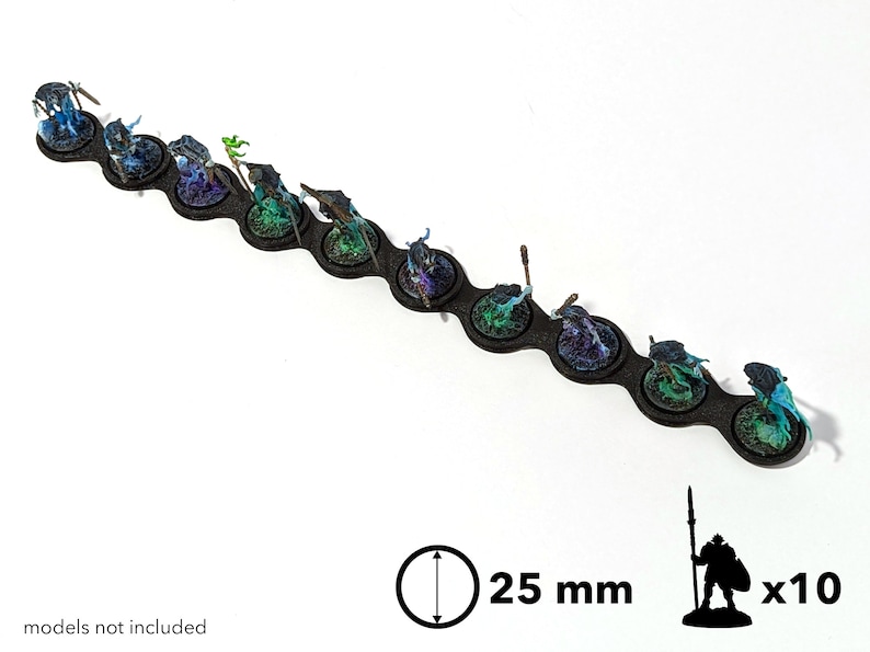 May include: A black plastic base with ten 25 mm round slots for miniature figures. The slots are filled with painted miniature figures with blue, green, and purple paint. The text "x10" is visible in the image.