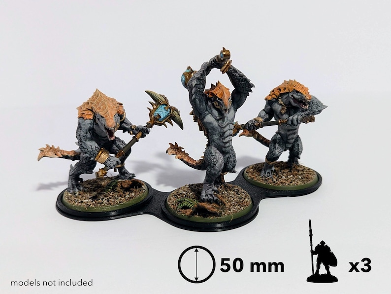May include: Three grey and orange painted miniature figures of lizard-like creatures with weapons, standing on a black three-sectioned base. The base is 50 mm in diameter.  x3