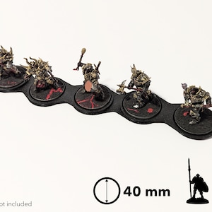 May include: Five black plastic miniature figure bases with red accents, connected in a row. Each base is 40 mm in diameter. The bases are designed to hold miniature figures. "models not included" is written below the bases.