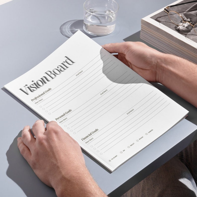 May include: A white vision board with sections for professional, personal, and financial goals. Each section has a list of bullet points with checkboxes for goal setting.