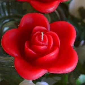 10 Red floating rose wedding candles for table centerpiece and reception decor.