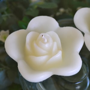 Ivory floating rose wedding candles for table centerpiece and reception decor. 10 pack