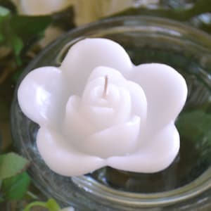 10 White floating rose wedding candles for table centerpiece and reception decor.