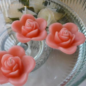 10 Coral Reef floating rose wedding candles for table centerpiece and reception decor.