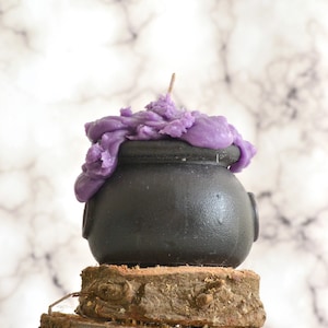 Witches cauldron candle scented in berry bewitching brew Halloween party or home decoration