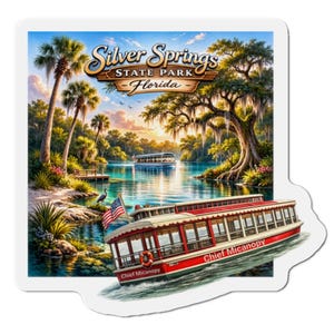 May include: A square sticker featuring a vibrant illustration of Silver Springs State Park in Florida. The image includes a red and white boat labeled "Chief Micanopy" on the water, palm trees, and the text "Silver Springs State Park - Florida".