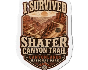 May include: A die-cut sticker featuring a landscape illustration of the Shafer Canyon Trail in Canyonlands National Park. The design includes a winding dirt road, red rock cliffs, a vehicle, and the text I SURVIVED SHAFER CANYON TRAIL.