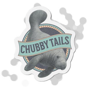 May include: A sticker featuring a detailed illustration of a manatee. The manatee is gray with a textured appearance, and the sticker includes the text "CHUBBY TAILS" on a banner. The design is set against a white background.