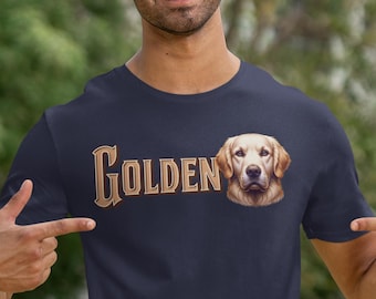 Könnte beinhalten: Marineblaues T-Shirt mit dem Wort "GOLDEN" in einem Vintage-Schriftzug und einer detaillierten Illustration eines Golden Retriever-Hundes. Das Fell des Hundes hat eine warme, goldene Farbe.