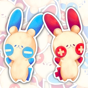 May include: Two stickers featuring cartoon bunny characters. One has blue ears and negative symbols, the other has red ears and plus symbols. Both have cream-colored bodies and smiling faces. The stickers are on a white background with similar images.