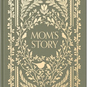 May include: A hardcover journal with the text "MOM'S STORY" in a decorative font. The cover is olive green with a cream-colored floral and bird design. The design includes birds, leaves, and branches.