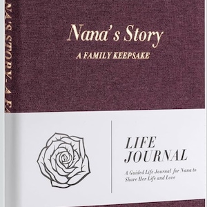 May include: A burgundy journal titled "Nana's Story" with the subtitle "A Family Keepsake." The journal features a white band with a rose illustration and the words "Life Journal." The journal is designed for sharing life and love.