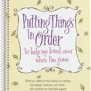 May include: A spiral-bound notebook with the title "Putting Things In Order" in purple script. The cover is light yellow with decorative leaf accents and text that reads "to help my loved ones when I'm gone."