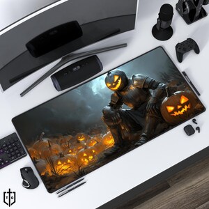 May include: A black and orange Halloween themed mousepad with a jack-o-lantern knight holding a pumpkin. The background features a field of glowing pumpkins.