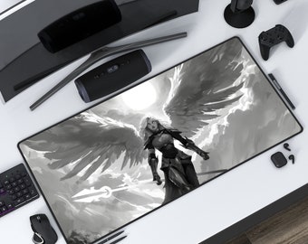 May include: A black and white gaming mouse pad featuring a warrior angel with wings spread wide. The angel is holding a spear and is standing in front of a cloudy sky.