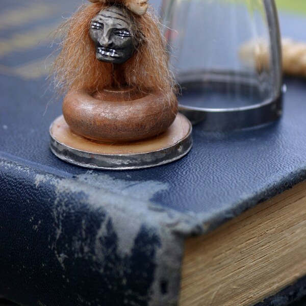 Shrunken head pendant  hand sculpted by artist Sherry Westfall Matthews