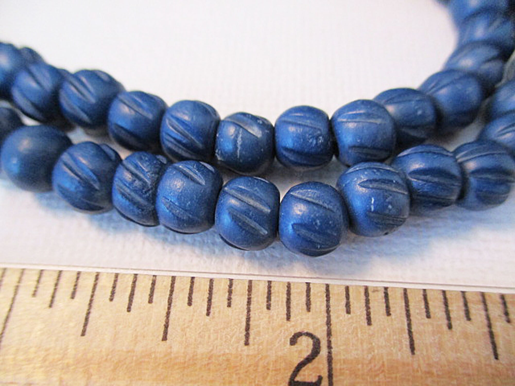 Bead, Czech glass druk, transparent aqua blue and glow-in-the-dark, 8mm  round. Sold per 8-inch strand, approximately 25 beads. - Fire Mountain Gems  and Beads