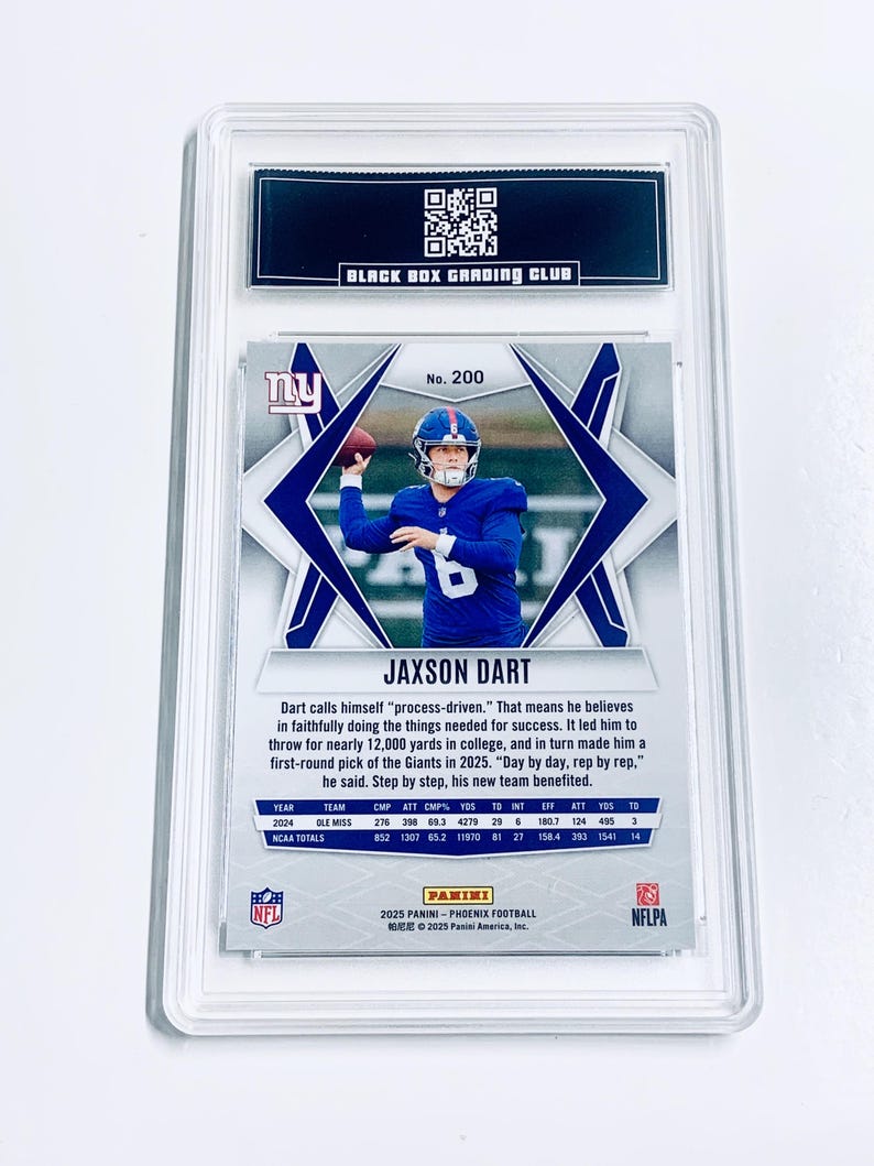 May include: A JAXSON DART football card, graded and encased in a protective holder. The card features a photo of the player in a blue uniform throwing a football. The card is from the 2025 Panini Phoenix Football series.