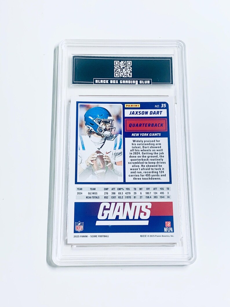 May include: A graded Jaxson Dart football card, featuring the New York Giants quarterback. The card is encased in a clear protective holder, with the "Black Box Grading Club" logo at the top. The card displays player stats and team information.