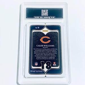 May include: A graded Caleb Williams football card, featuring the Chicago Bears logo. The card is encased in a clear plastic holder with the text "BLACK BOX GRADING CLUB" at the top. The card details Williams' performance.