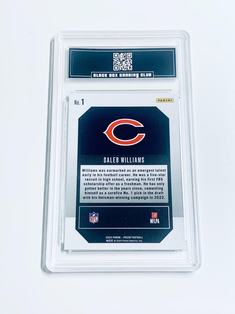 May include: A Caleb Williams football card, graded and encased in a protective holder. The card features the Chicago Bears logo and the text "CALEB WILLIAMS". The holder has the text "BLACK BOX GRADING CLUB" at the top.