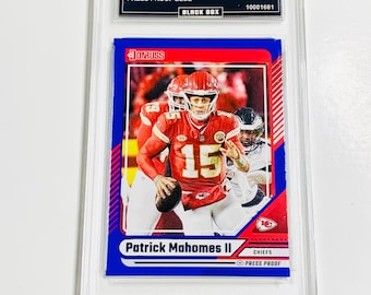 May include: A 2024 Donruss Patrick Mahomes II Press Proof Blue trading card, graded GEM MT 10, encased in a protective holder. The card features a vibrant image of Mahomes in his Chiefs uniform, with the Donruss logo and player details.