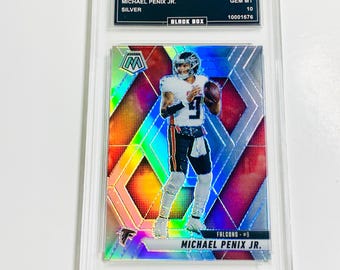 May include: A graded sports trading card featuring Michael Penix Jr. from the 2025 Mosaic series. The card has a silver finish and displays a colorful mosaic design. The card is encased in a clear protective holder.