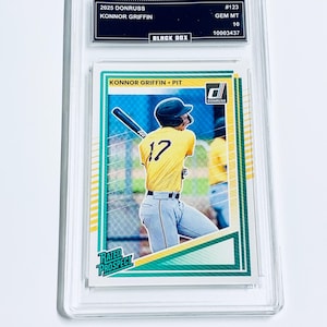 May include: A rustic wooden sign with the text "Welcome to our home" in white lettering. The sign features a distressed finish and a simple, inviting design, perfect for a front porch or entryway.