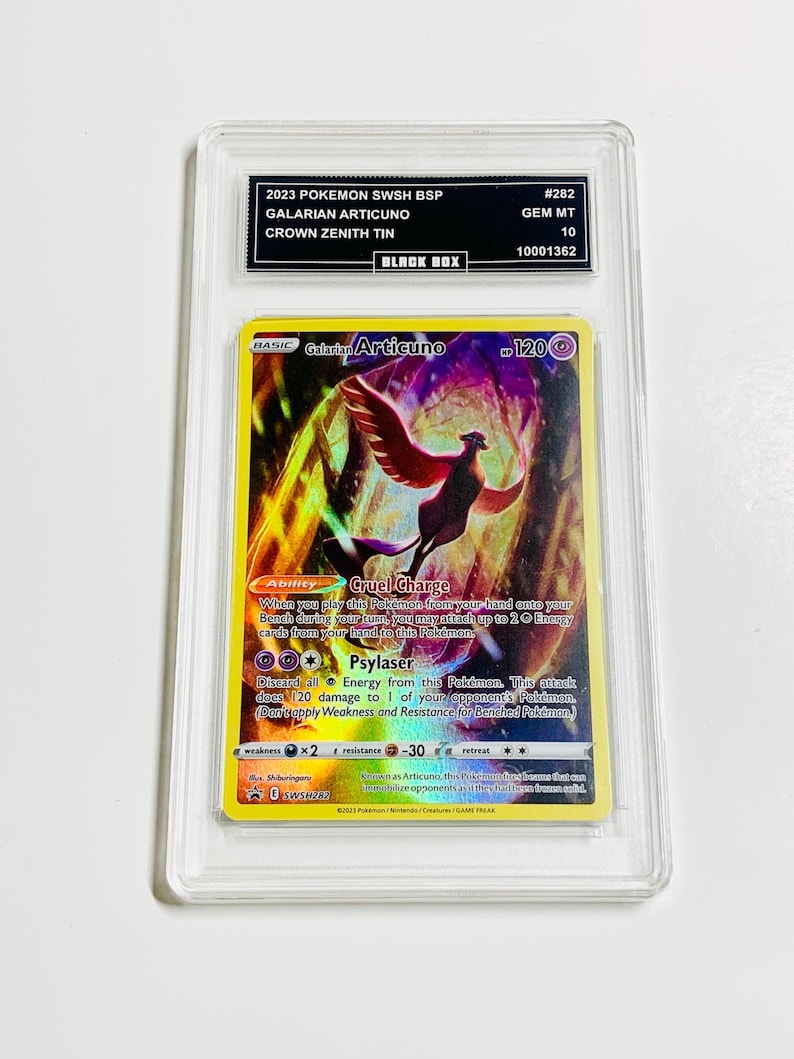 May include: A graded Pok&eacute;mon card featuring a Galarian Articuno with a colorful design. The card is encased in a clear protective holder with text that reads "2023 POKEMON SWSH BSP" and "CROWN ZENITH TIN". The card is labeled "GEM MT 10".