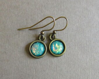 Faux opal small round resin earrings in bronze settings. Lead and nickel free antique brass ear wires. Lightweight earrings. Blue green opal