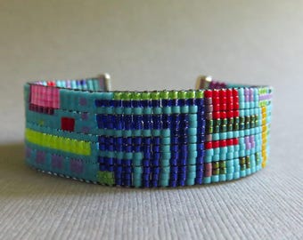 Turquoise & bright colored glass Delica bead loomed bracelet. Hand loomed aqua and brightly colored glass seed bead bracelet. Free shipping.