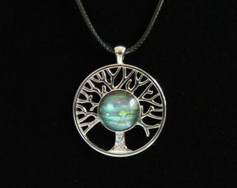 Silver tree of life pendant necklace with flow art blue cabochon on black waxed cotton cord. Tree of life necklace. Blue tree of life.