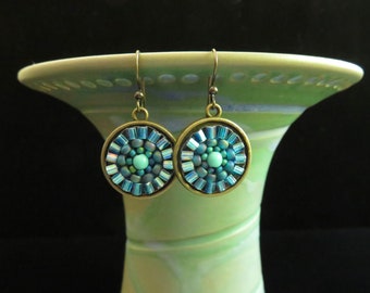 Aqua and turquoise hand beaded mosaic mandala earrings. Beaded mandala mosaic earrings. Turquoise and aqua hand beaded mandala earrings.