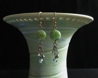 Turquoise green Picasso cushion bead triple dangle earrings. Picasso bead green turquoise tassel earrings. Picasso and crystal earrings.