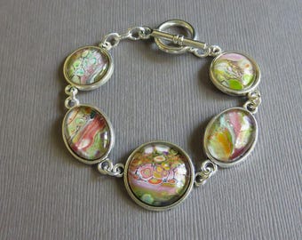 Pastel fluid art bracelet. Flow art bracelet. Wearable art acrylic poured paint bracelet. Glass cabochon bracelet. Paint poured bracelet.