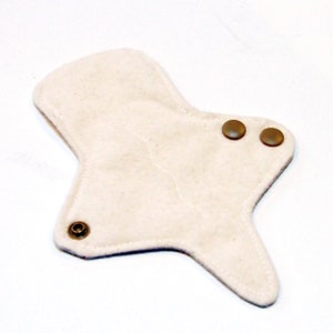 May include: A white reusable cloth menstrual pad with three brown snap buttons.