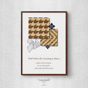 May include: Framed art print featuring woven patterns in shades of brown and beige, with dark blue floral accents. The print includes the text "And when the weaving is done..." and the Lamduan Studio logo.